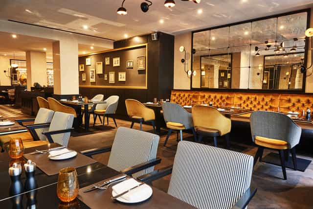 Grüner Salon, a stylish restaurant for intimate events with modern decor and natural light.
