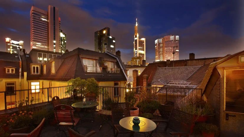 "Rooftop bar at Hotel Nizza with city skyline view, perfect for private events and gatherings."