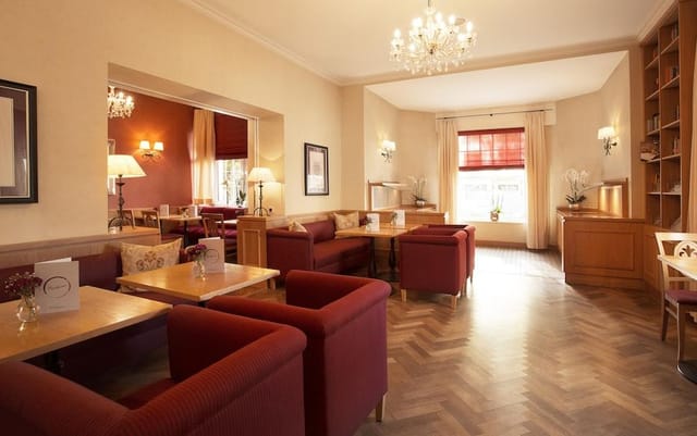 Elegant conference room with warm lighting, perfect for networking events and gatherings.