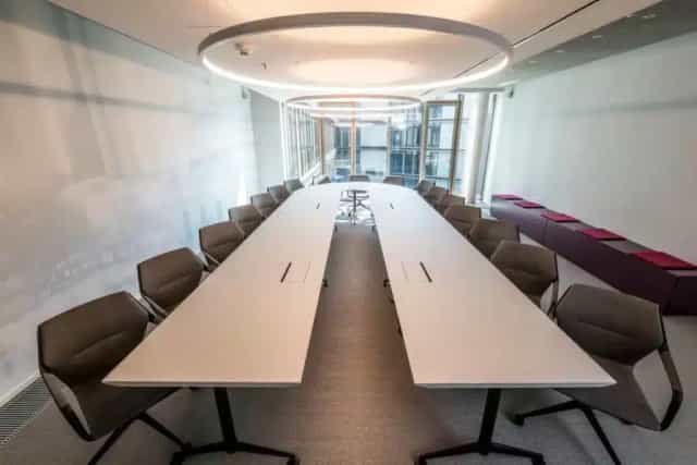 Modern meeting room in Satellite Office Frankfurt, featuring a sleek conference table.