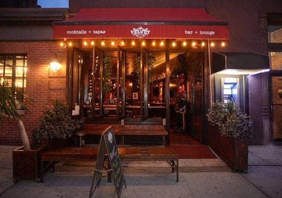 Cozy Velvet Brooklyn cafe with outdoor seating for casual meetings and events.