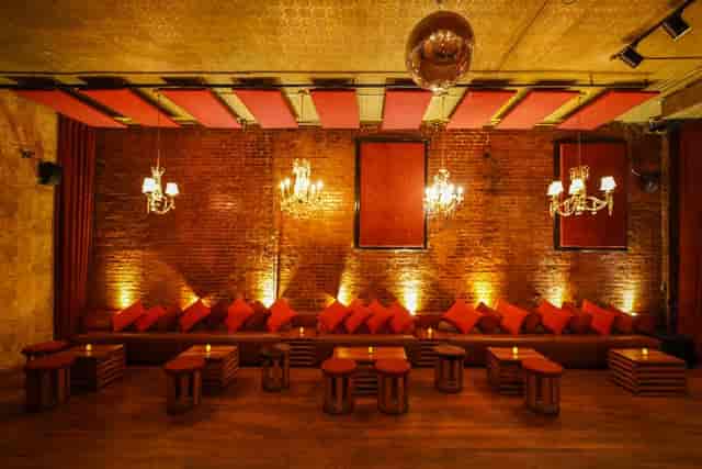 Lounge in Velvet Brooklyn: elegant event space with exposed bricks for networking and gatherings.