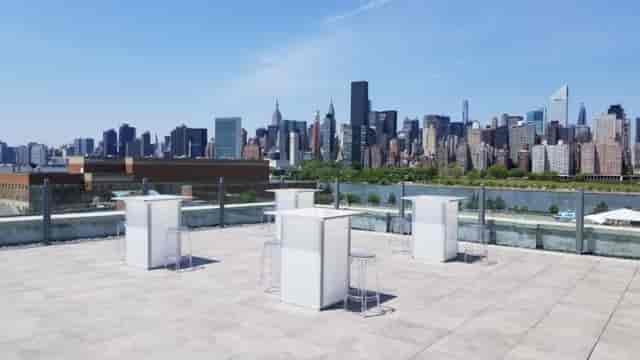 Sleek rooftop venue with skyline views for networking events and cocktail receptions.