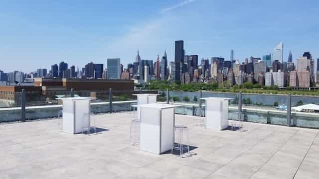 Sleek rooftop venue with skyline views for networking events and cocktail receptions.