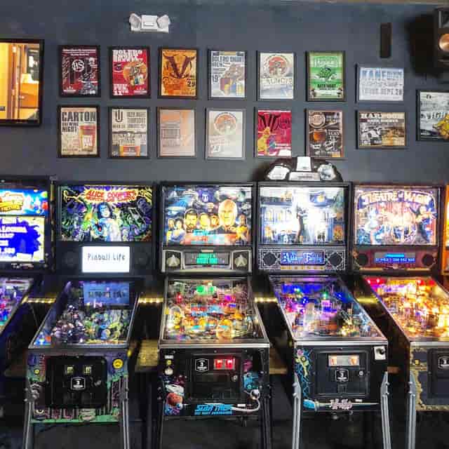 Vibrant pinball arcade at Barcade, perfect for team-building events and social mixers.