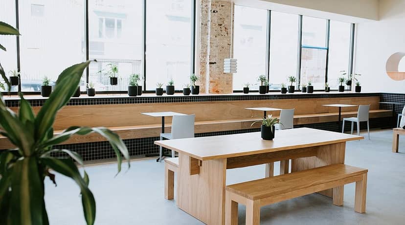 Modern meeting space at TALEA Beer Co. with natural light, ideal for creative brainstorming.