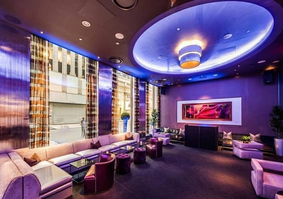 Sophisticated lounge at 48 Lounge with ambient lighting for networking events.