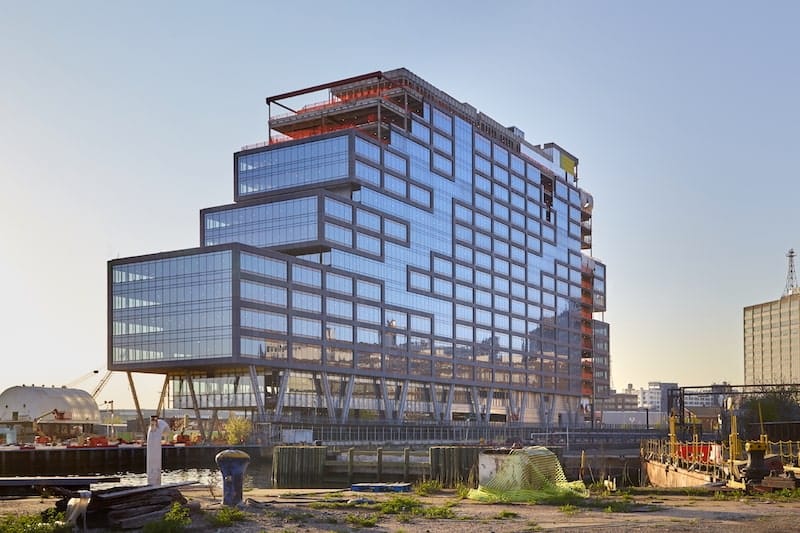 Modern Conferencing Center in Dock 72 with glass facades, ideal for innovative meetings.