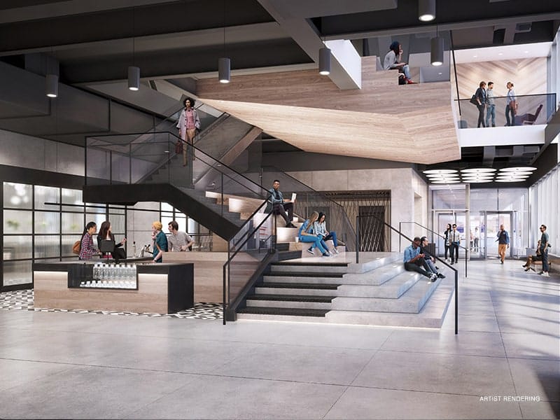 Modern open lobby with dynamic staircase for meetings and events at Dock 72.