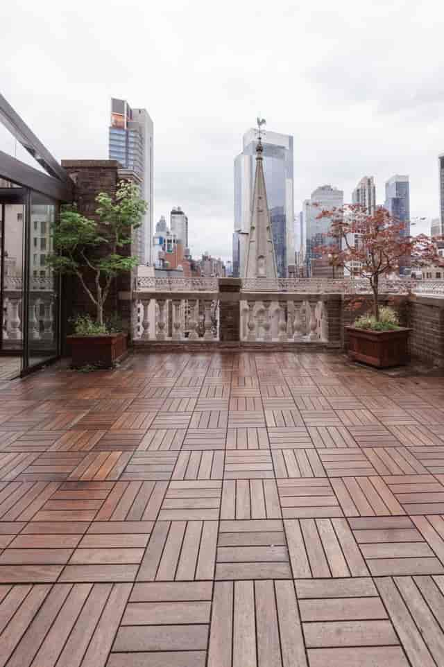Spacious Midtown Loft rooftop terrace with wooden deck for cocktail parties and events.