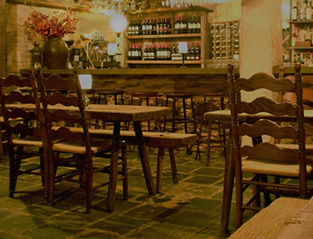 Cozy Peasant bar with wooden decor, perfect for intimate gatherings and networking events.