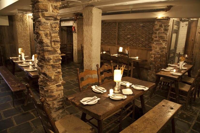 Cozy rustic dining room with wooden tables, ideal for private dinners and events.