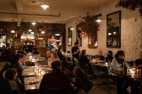 Vibrant Peasant restaurant dining room, rustic decor, ideal for intimate events.