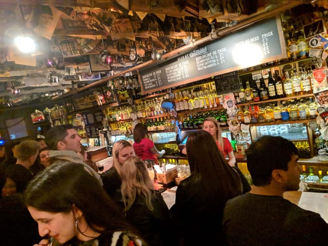 Taproom Front & Back at The Dead Rabbit: lively bar ideal for networking events and mixers.