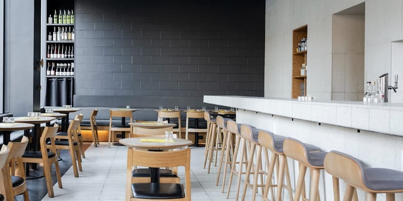 Modern ATLA NOHO restaurant, stylish wooden decor for events and meetings.