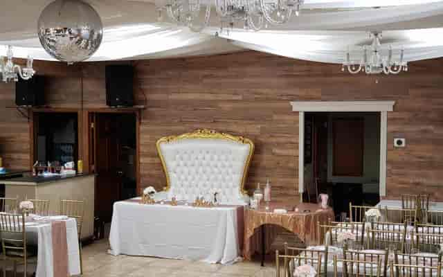 Elegant Occasions Hall in Queens for weddings, featuring white and gold decor with chandeliers.