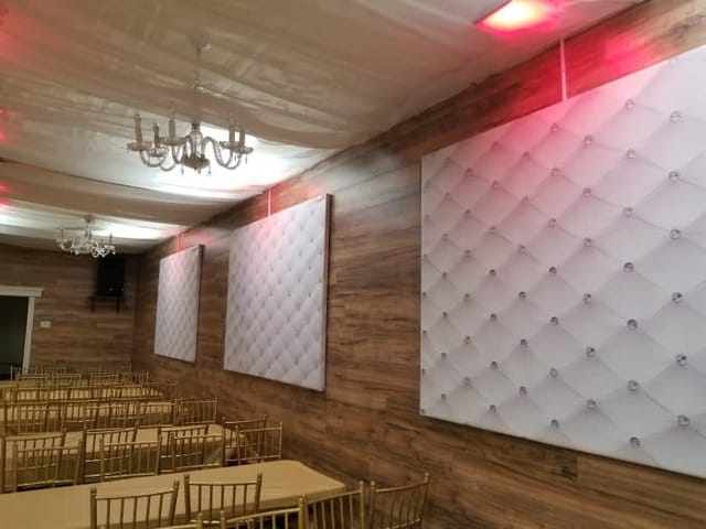 Sophisticated Skyline Hall with tufted walls, ideal for weddings and corporate events.