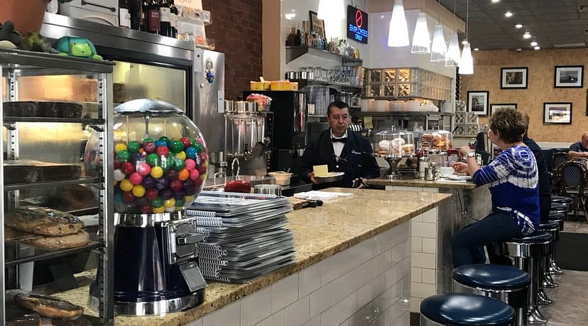 Nostalgic diner counter with stools at The Mansion’s breakfast restaurant for gatherings.