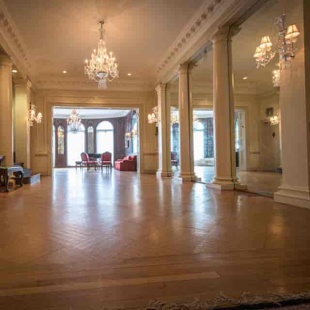Elegant Grand Ballroom with chandeliers, perfect for corporate events and gatherings.
