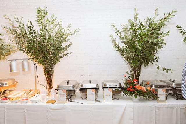 Elegant buffet setup with greenery in Loft, Garden House NYC for events.