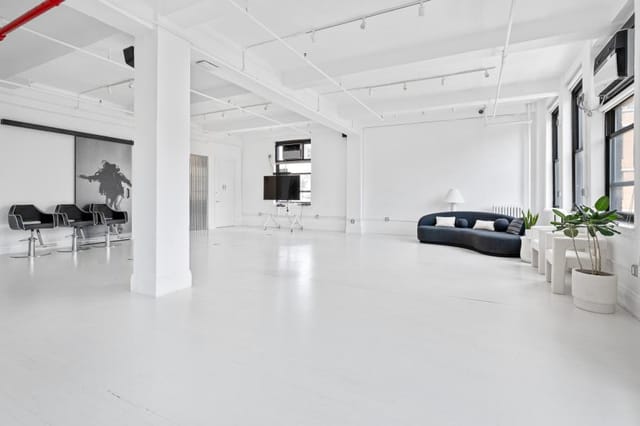 Modern event space in Garden House NYC with large windows, ideal for workshops and networking.