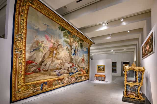 Elegant gallery with exquisite tapestry, ideal for art events and private viewings.