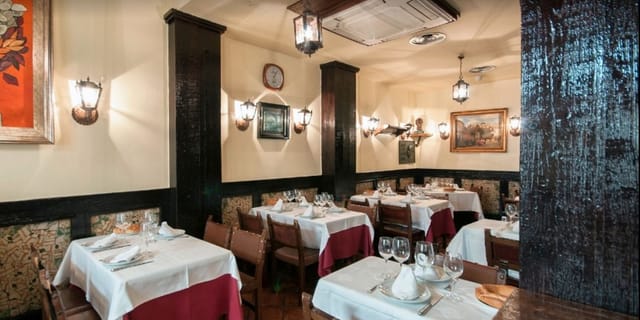 Intimate restaurant dining space in Casa Lucio, ideal for meetings and private events.