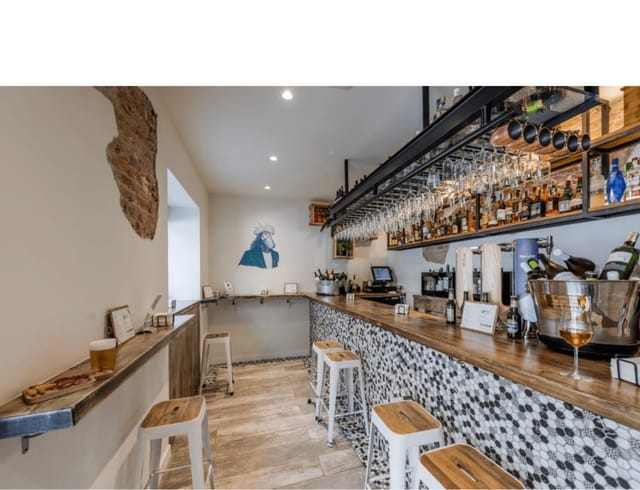 Chic bar area at Zalamero Taberna for intimate events and social gatherings.
