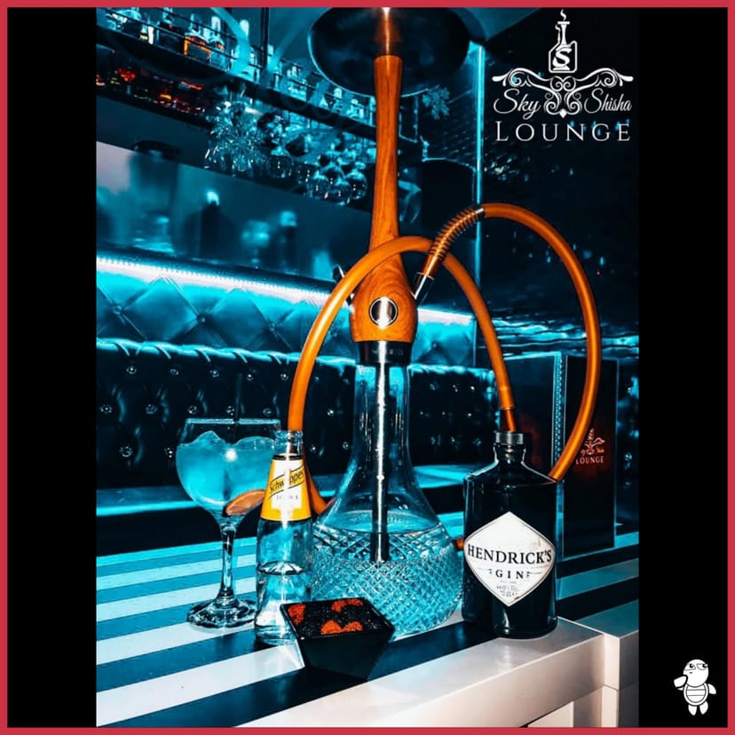 Stylish cocktail setup with Hendrick's gin at Aire Sky Bar for events and networking.