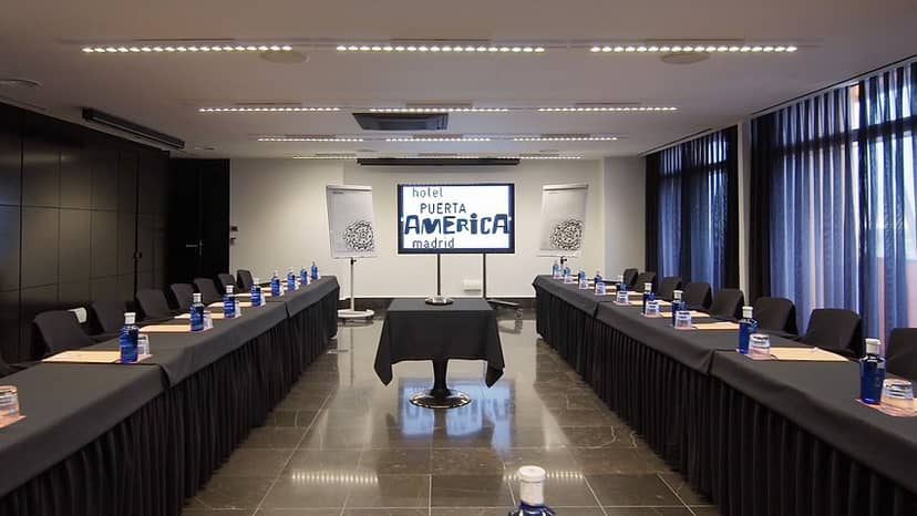 John Pawson Function Room: modern corporate meeting space with formal table settings.