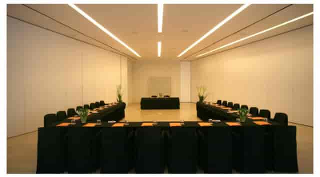 John Pawson Function Room at Puerta América Hotel, minimalist U-shaped setup for corporate events.