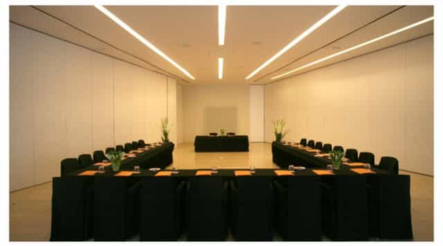 John Pawson Function Room at Puerta América Hotel, minimalist U-shaped setup for corporate events.