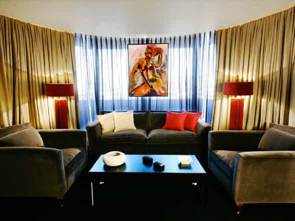 Sophisticated lounge at Puerta América Hotel for networking and informal meetings.