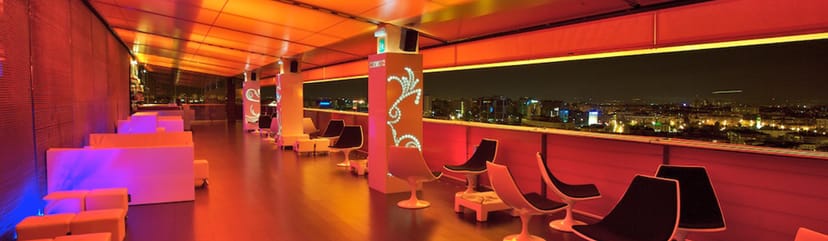 Skynight Lounge event space with modern seating and city skyline views for receptions.
