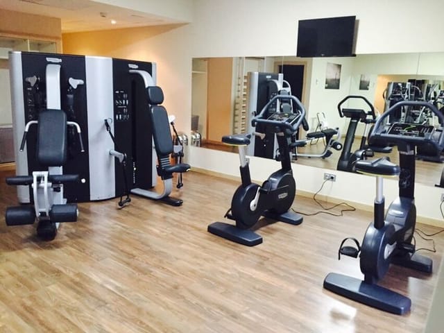 Hotel Gran Bilbao fitness center with gym equipment for corporate wellness events.