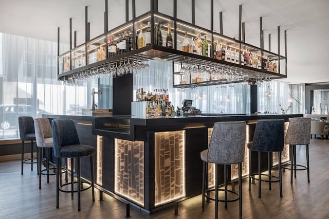 Modern bar at AC Hotel Madrid Feria, ideal for cocktail receptions and networking events.