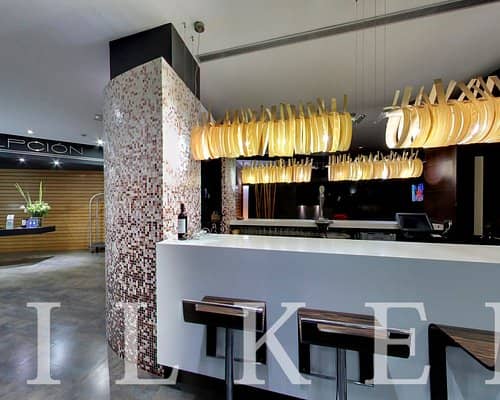 Sleek bar area of Salón Zarzuela, ideal for networking events and casual meetings.