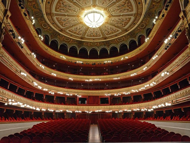 Palco Platea at Teatro Calderón, elegant theater with ornate ceiling for performances.