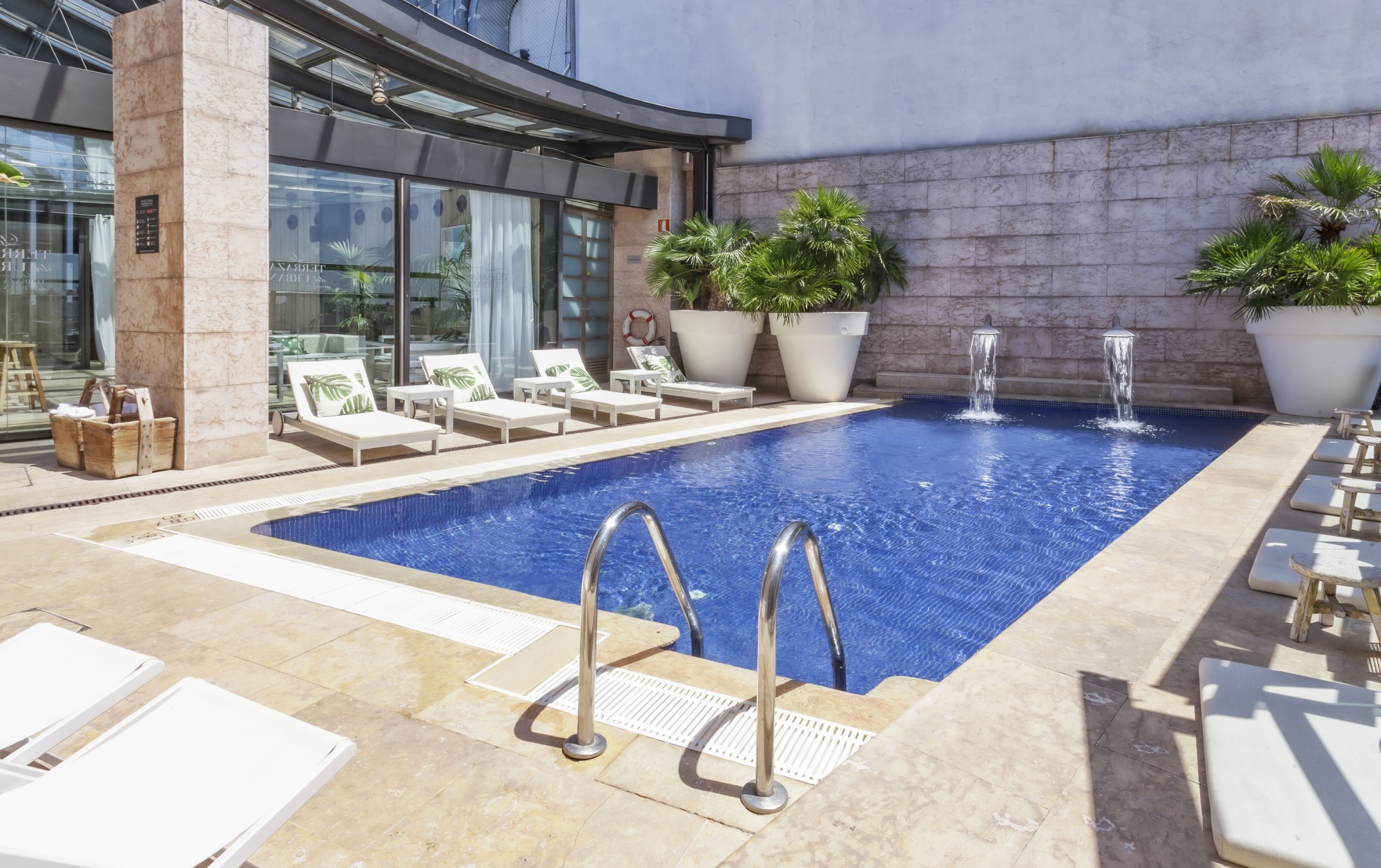 Sleek outdoor pool area at Hotel Urban, ideal for sophisticated events and gatherings.