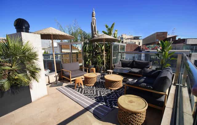 Stylish rooftop lounge at Hotel Urban, perfect for networking events and gatherings.