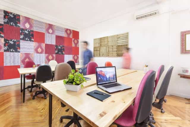 Modern meeting space with vibrant wall art, perfect for collaboration and events.