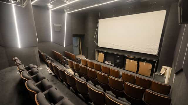 Modern cinema with tiered seating for corporate events and film screenings.