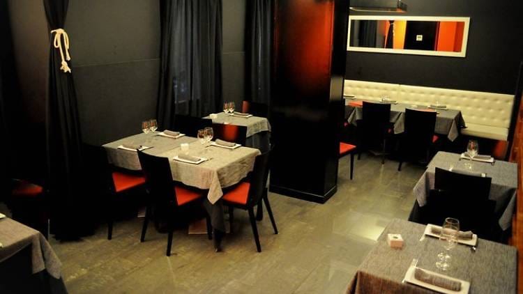 Sleek restaurant interior with vibrant seating, perfect for upscale events and gatherings.