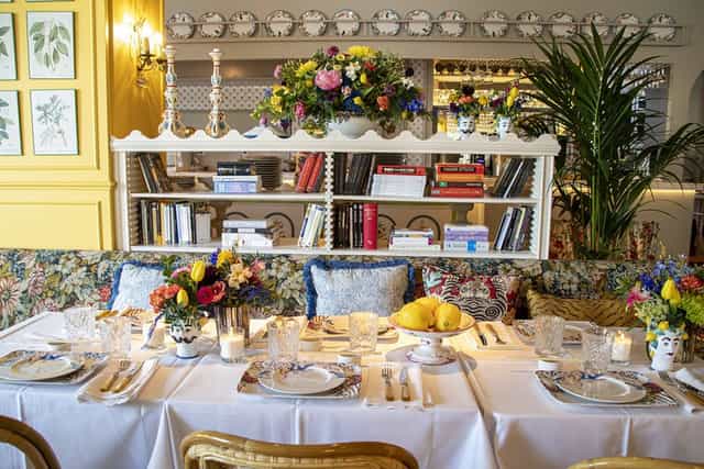 Elegant dining table with floral centerpieces for charming events or gatherings.