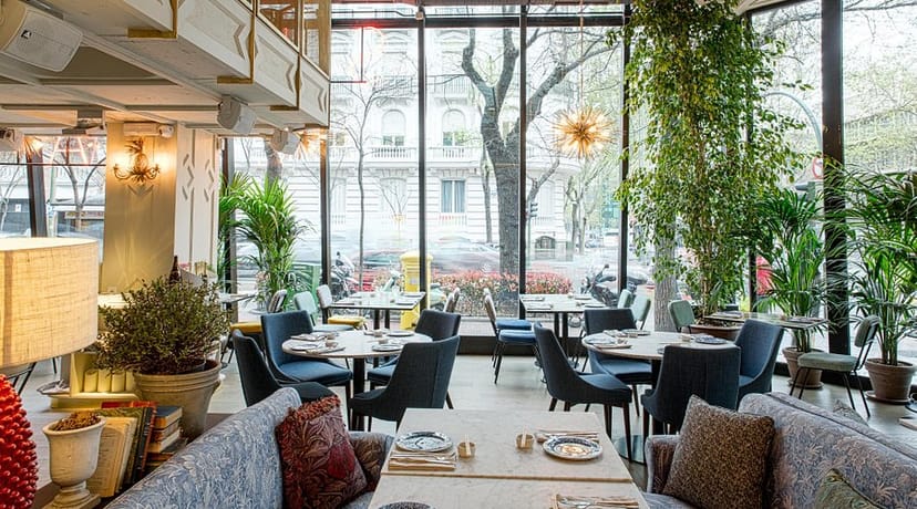 Stylish dining area with large windows for upscale meetings and intimate events