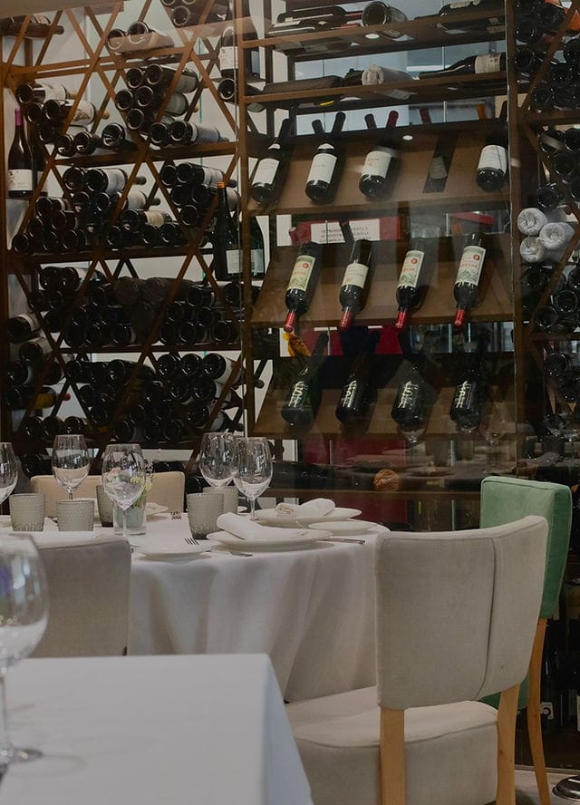 Upscale restaurant dining setup with elegant tables for corporate events and celebrations.
