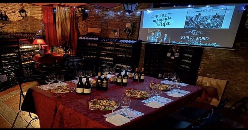 Elegant dining table in La Bodega de los Reyes wine cellar for intimate events and tastings.