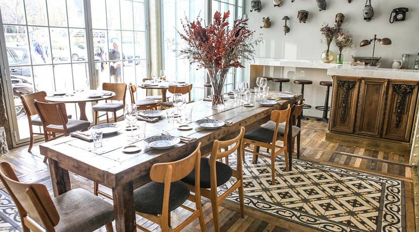 Elegant dining space for corporate events at El Perro Y La Galleta with rustic wooden table.