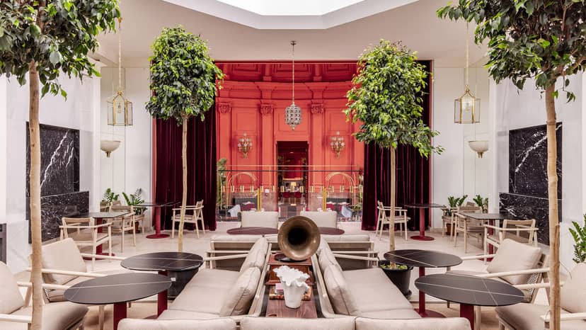 "Cervantes Room at Casa de América: elegant venue for meetings and events with red accents."