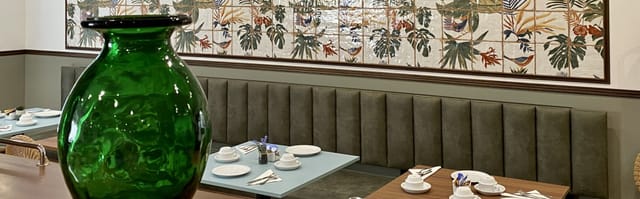Intimate hotel bar with elegant decor, perfect for networking events and small meetings.